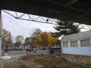 The roof over zone 1 in the swimming pool has been removed to make room for bond beams, new joists and a new steel roof deck.
