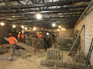Interior walls are now being constructed, such as here in the Boys' Locker Room.